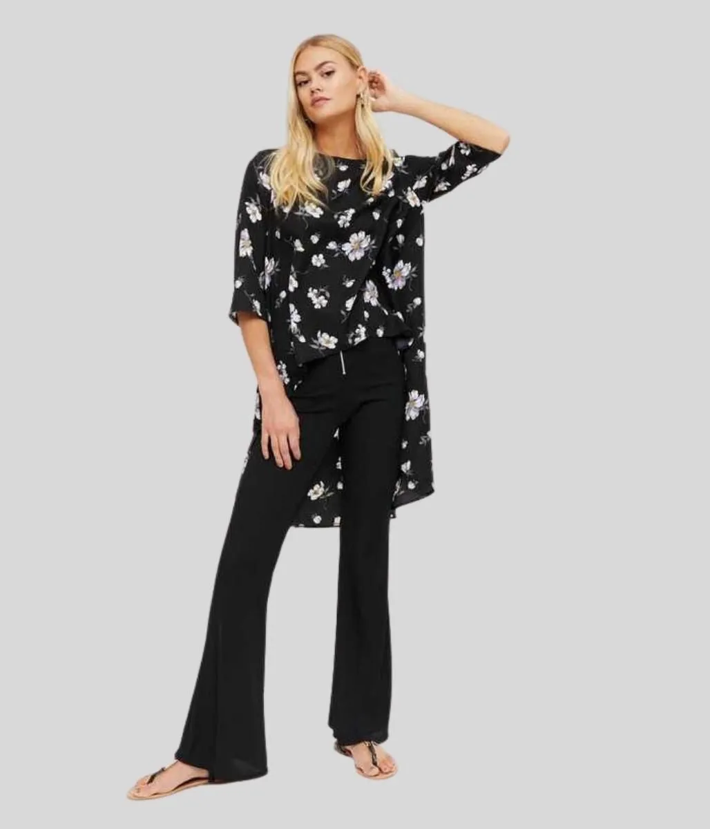 Black Floral Dipped Hem Top